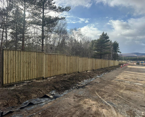 Timber acoustic fence installed alongside construction works on the A9 Tomatin to Moy project